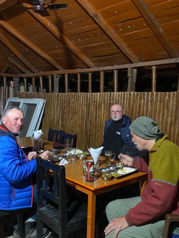 Guests enjoying dinner in the traditional bamboo restaurant